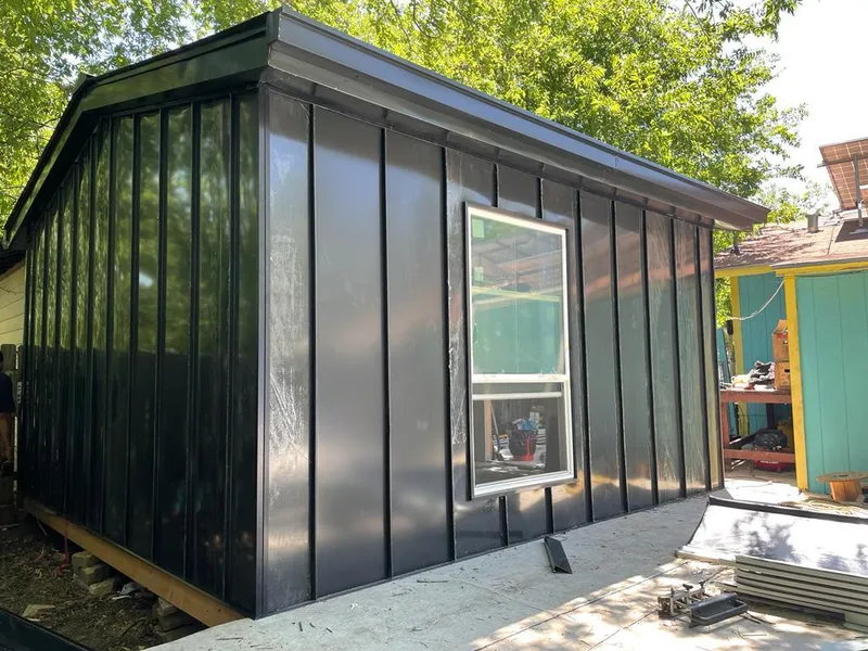 Black standing seam metal wall panels for Roof Inspection in Box Elder